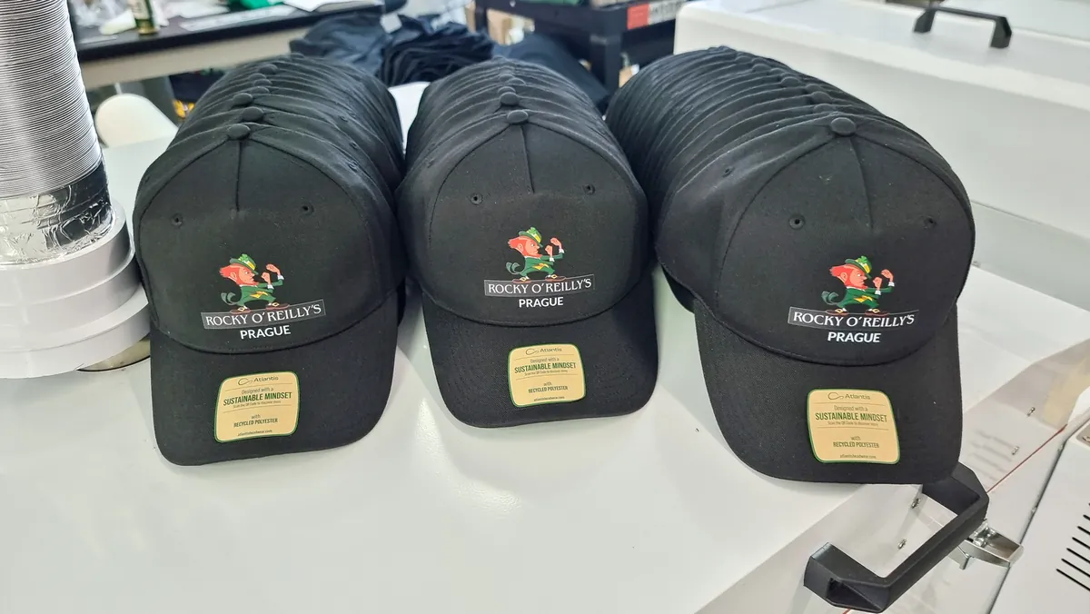 Caps with the logo of a Prague venue